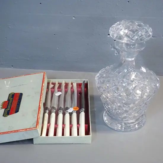 heavy crystal stoppered decanter H-260 and a box of 6 small faux ivory/bone handled knives
