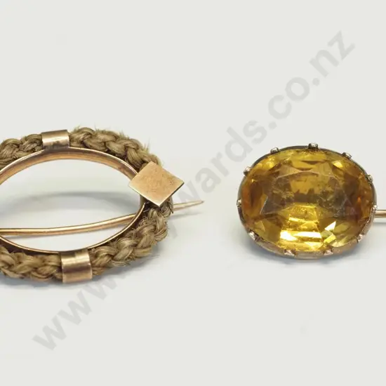 9ct rose gold mourning brooch with plaited bezel of hair, oval claw set yellowstone brooch