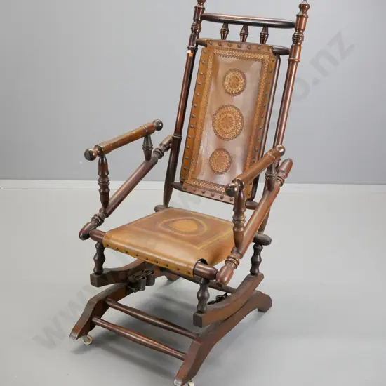 Dexter cotton reel rocking chair with tooled leather seat & back, on casters - some rubbing & scuffing to polish