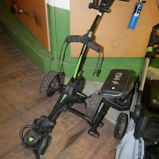 MGI battery powered golf trundler with charger and umbrella