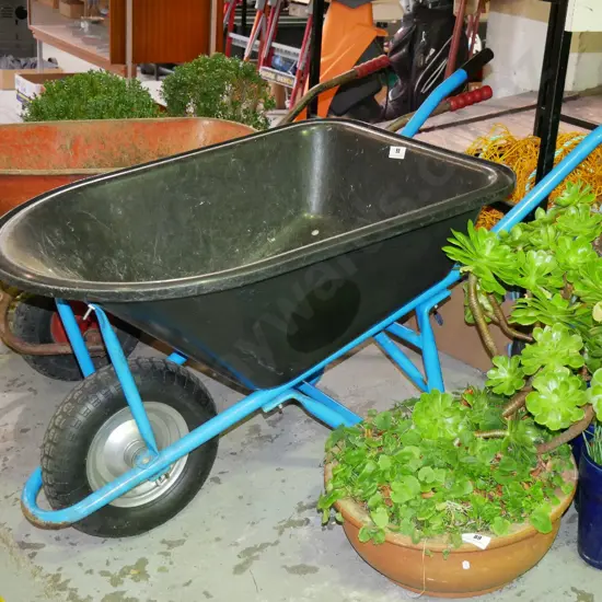 black plastic contractors wheelbarrow