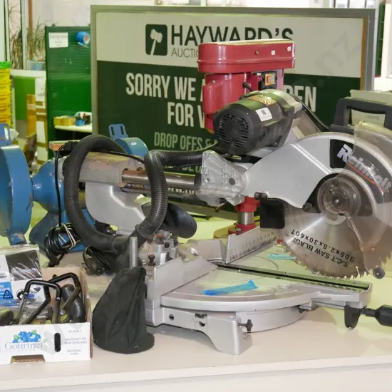 Reinholt compound mitre saw and box of accessories