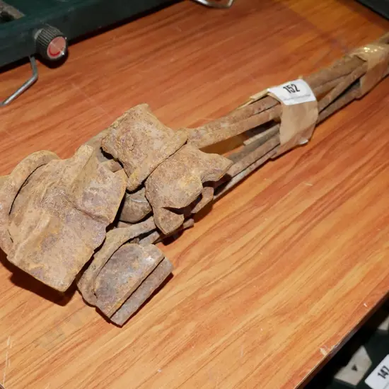 bundle of rusty blacksmith's tools