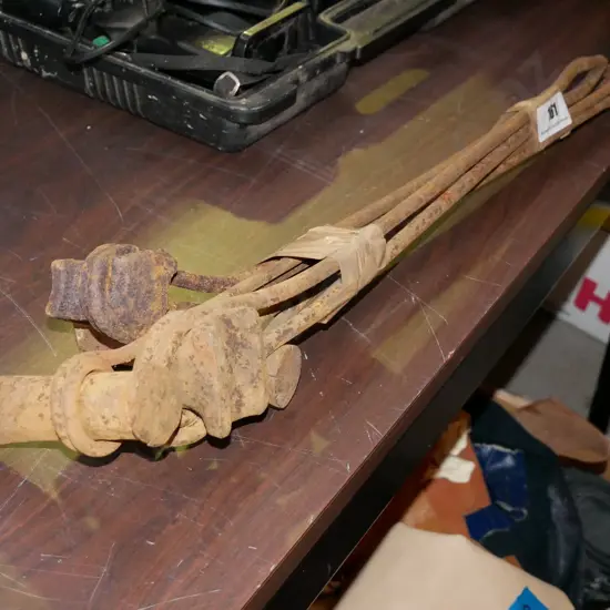 bundle of rusty blacksmith's tools