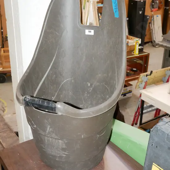 black plastic wheeled garden implement carrier