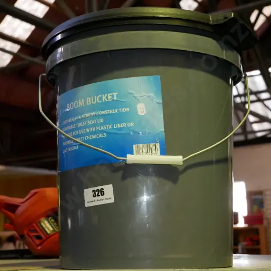 Boom bucket with removable toilet seat lid