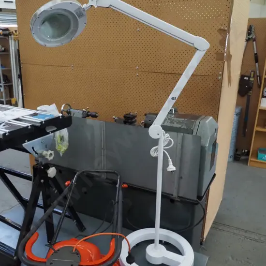 illuminated magnifying glass on stand