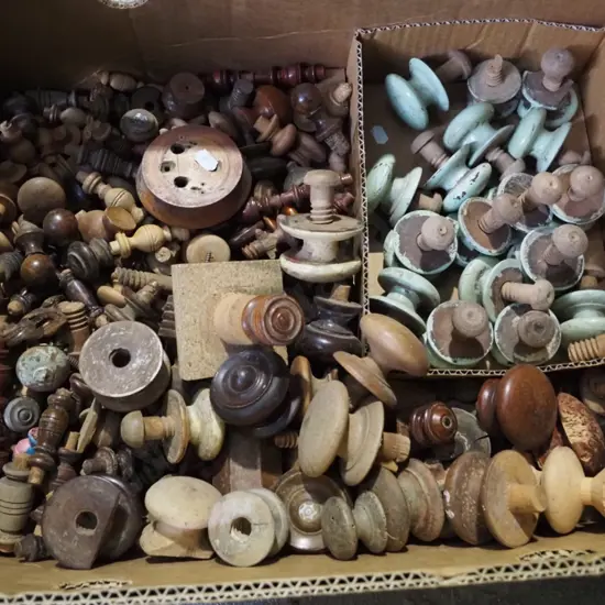 box of wooden cupboard handles etc