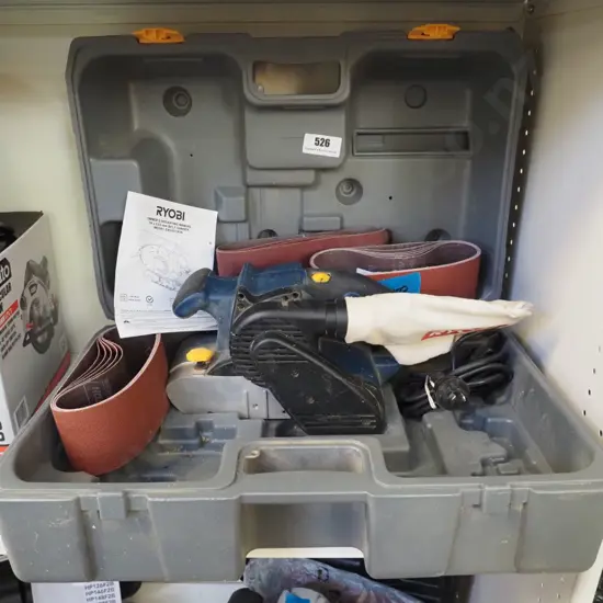large Ryobi belt sander with extra belts and carry case