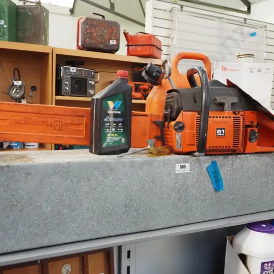 Husqvarna 61 chainsaw with tin case, fuel container, files etc