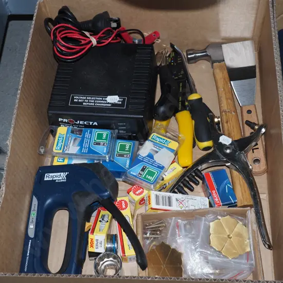 box; staple gun, battery charger, hammer etc