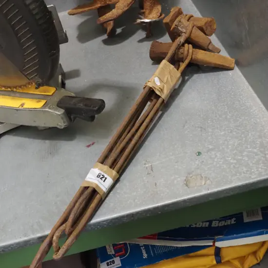 bundle of rusty blacksmith's tools