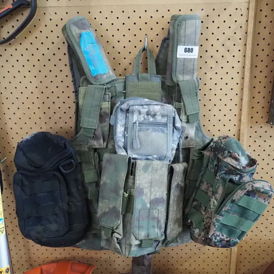 camouflague military vest with numerous pockets