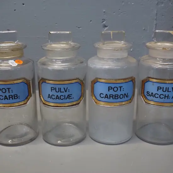 4 stoppered apothecary bottles with labels - some stoppers stuck - H-220 D-90