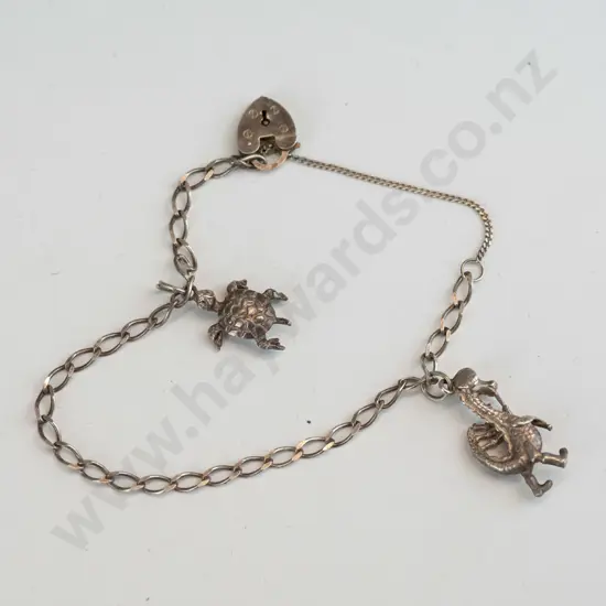 silver charm bracelet with turtle & dragon charm  & satety chain  stamped 925