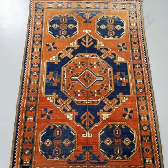 hand-knotted wool floor rug - brown, blue and cream - central geometric motif. Some wear, fading to one end L-1360 W-880