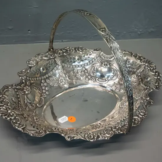 sterling silver handled dish with embossed floral motifs H-190 L-310 W-240