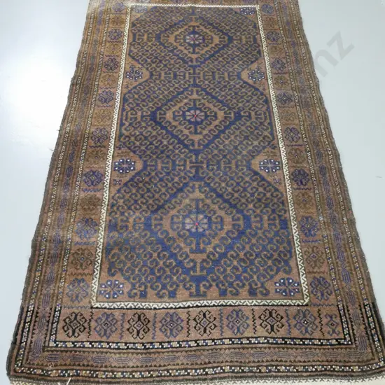 hand-knotted tribal wool floor rug - dark blue and brown, fading, esp. to one end L-2100 W-1200