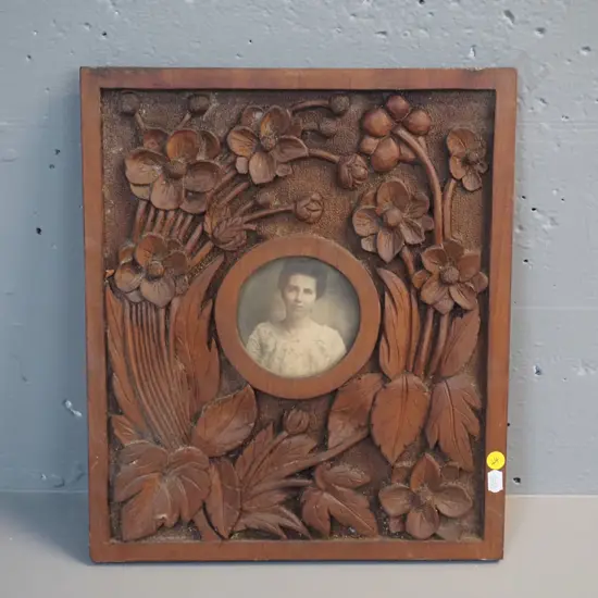 vintage heavily carved timber picture frame with small portrait photograph. Frame H-360 W-320