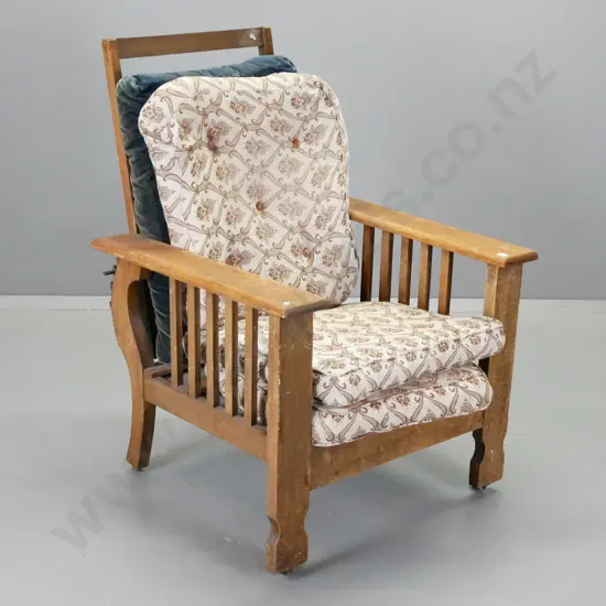 vintage Morris chair, seat replaced with metal panel, on original porcelain casters, loose seat and back cushions, some