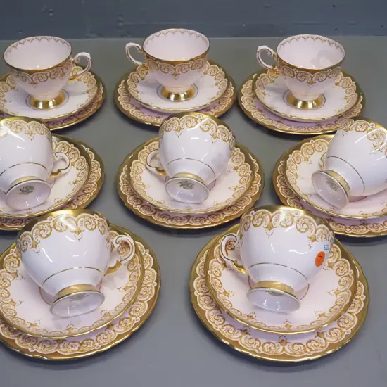 set of 8 Tuscan bone china pink glaze gilt pattern trios