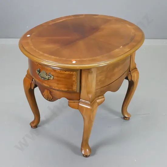 reproduction mahogany cab-leg oval side table with drawer w/quartered veneer top with banded edge, small piece of veneer