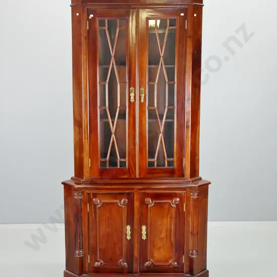 mahogany corner cabinet with 2-door display top with astragals, 2 panelled doors in base, brass drop handles H-1920