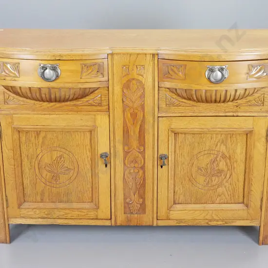 deco bow-front oak sideboard w/ 2 drawers, 2 doors, carved detail, original drop handles, escutcheons, no key H900 W1320