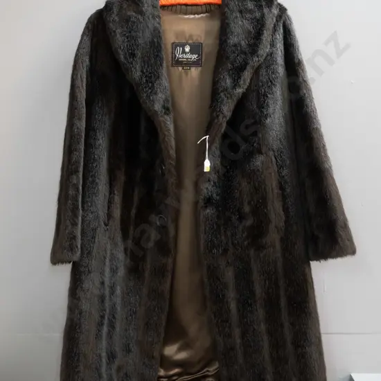 brown short fur coat with Heritage Apparel and "SSW" labels