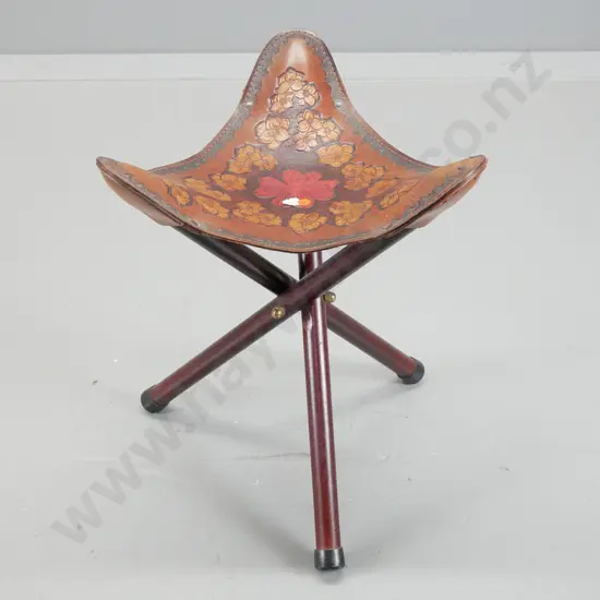 triangular collapsible tripod stool with floral motif tooled leather seat H-480 W-390