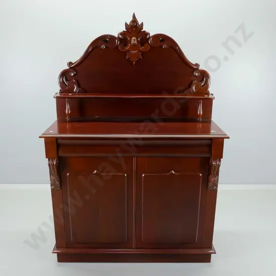 reproduction mahogany chiffonier with 2 doors, 1 lined & divided drawer, corbels and carved upstand H1670 W1070 D460