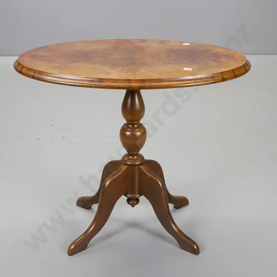 reproduction walnut and beech oval top wine table on turned column with 4 sweeping cab legs,