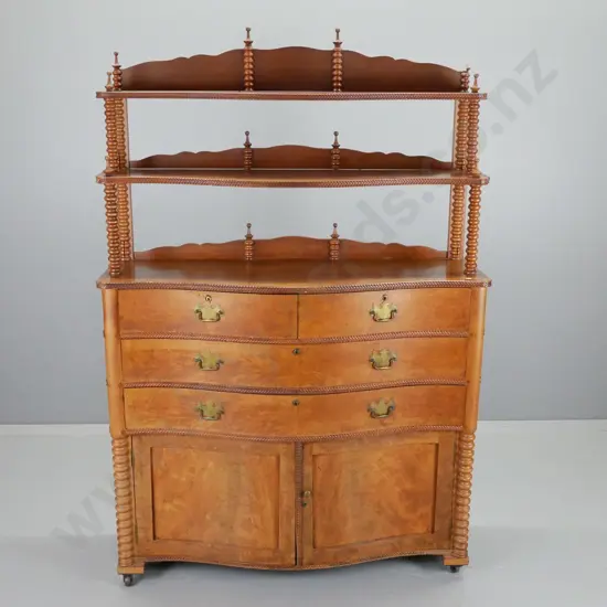 antique walnut and flame veneer bow-front chiffonier with 3 drawers, 2 doors, cotton reel turnings, herringbone beading,