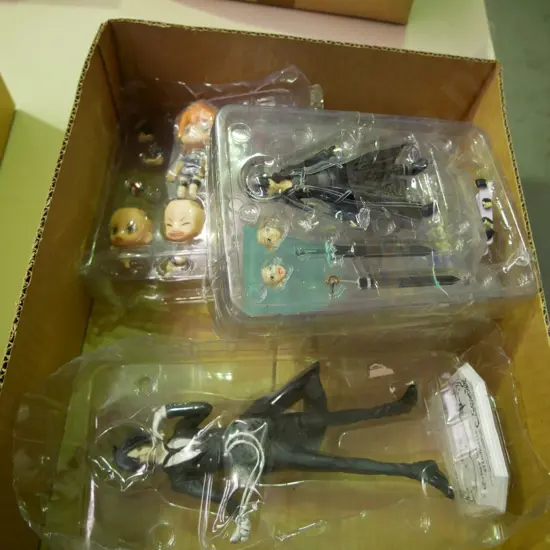 box of various figurines