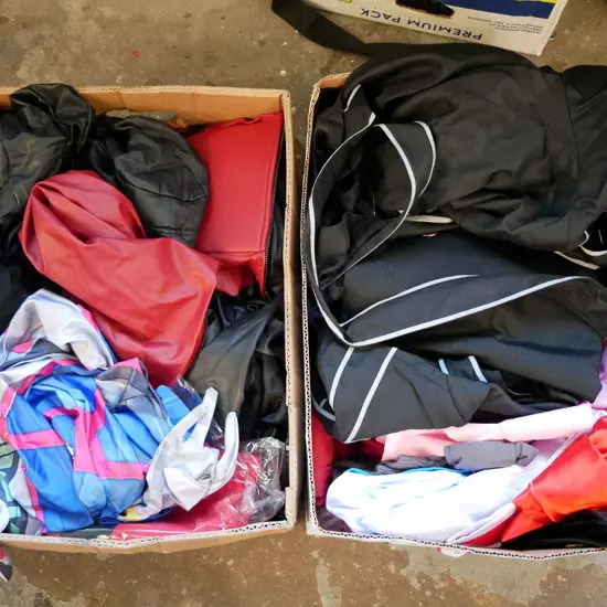 2 boxes of opened costumes - red dots