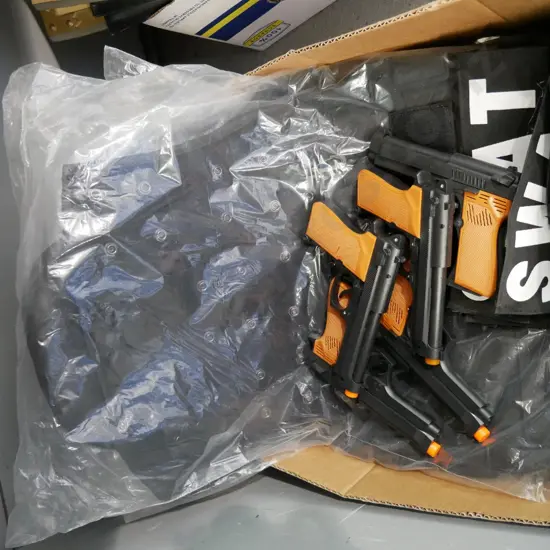 box of SWAT costume items - 5 vests and 5 plastic guns