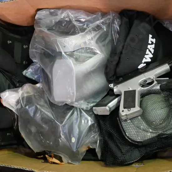 box of SWAT costumes - vest, masks, caps, kneepads etc.