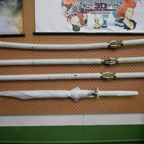 3 x fantasy swords and a sword handle umbrella
