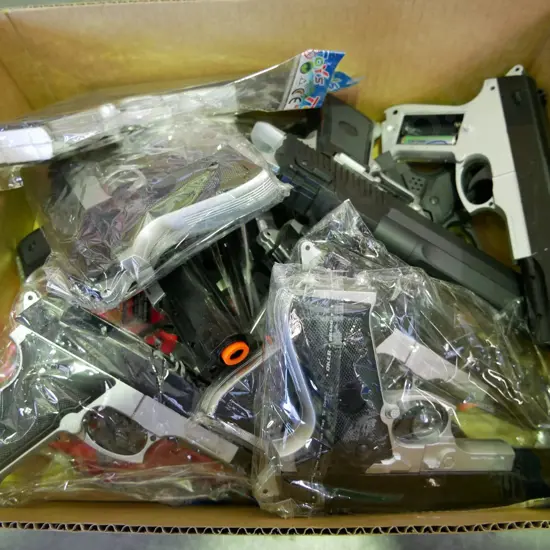 box of plastic pistols