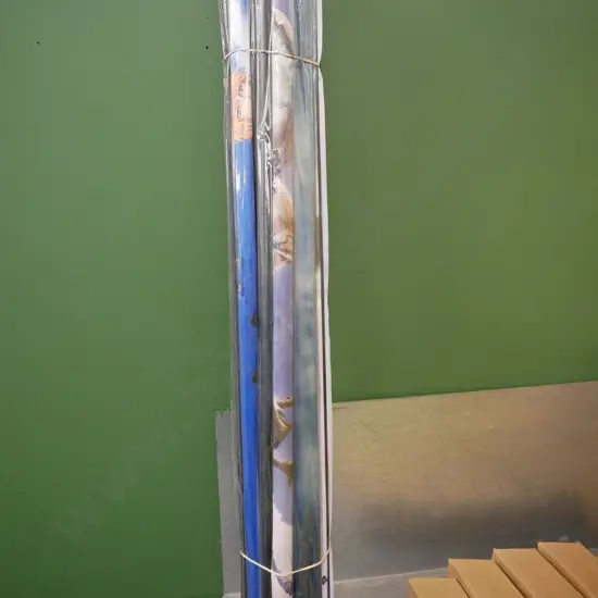 bundle of wall hanging prints on scrolls