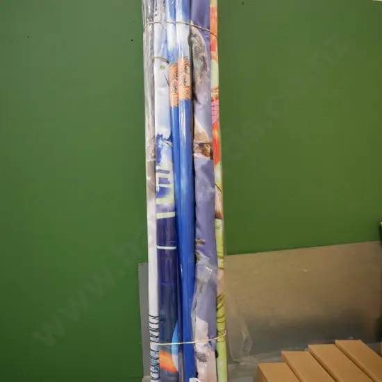 bundle of wall hanging prints on scrolls