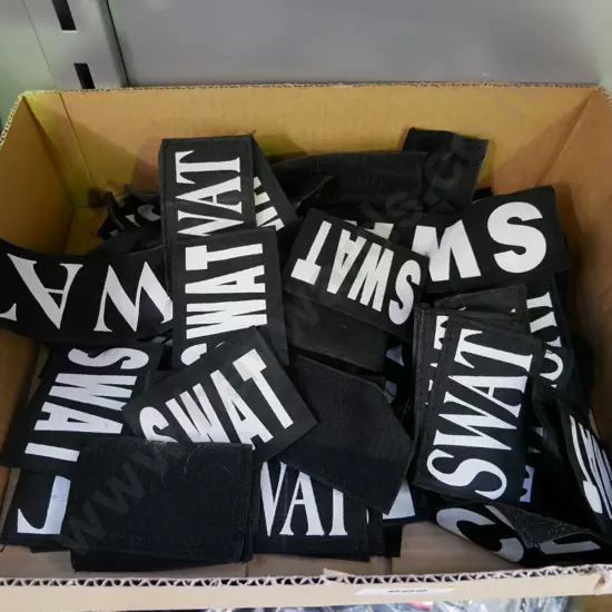 box of SWAT badges