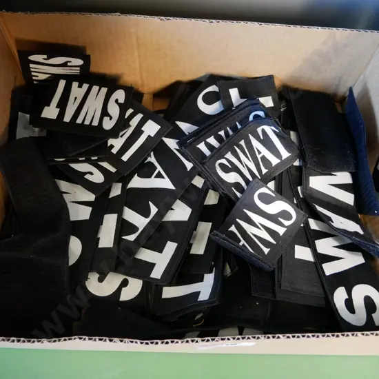 box of SWAT badges