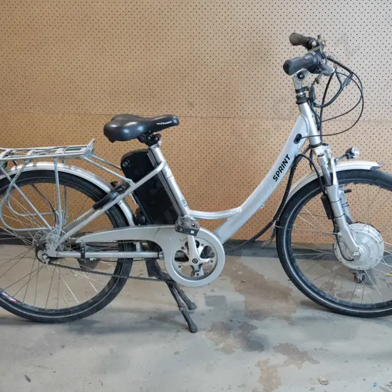 Silver Sprint Electric bike- light on the front, bag rack on the back tyre. Key in the battery