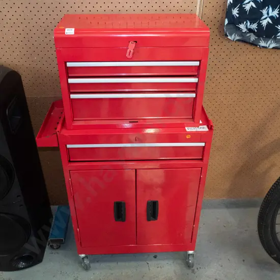 Red Metal tool box on 2 door, 1 drawer chest on castors