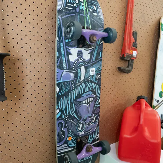 Airwalk skateboard with purple and blue underside