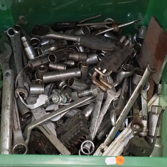Miscellaneous tools in plastic bin