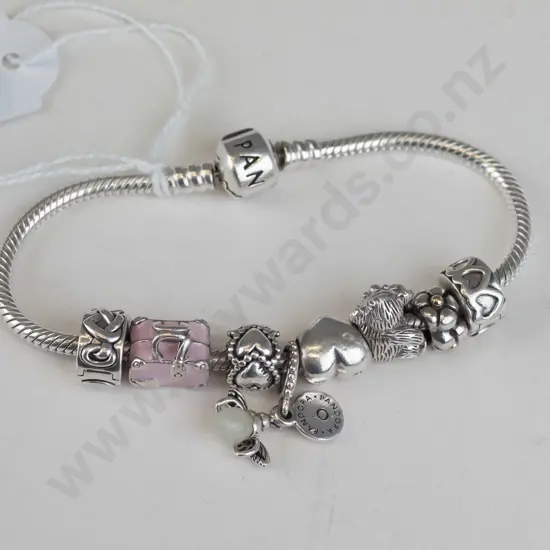Pandora bracelet, 8 charms including Koala and pink suitcase