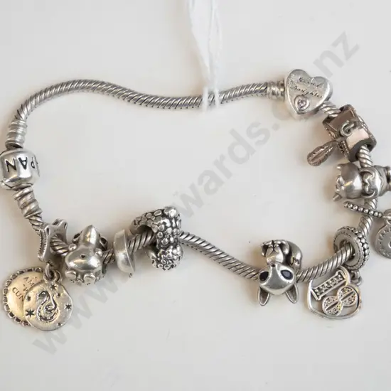 Silver Pandora Charm Bracelet with multiple charms.