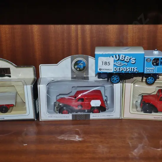 3 boxed and one unboxed toy vehicles